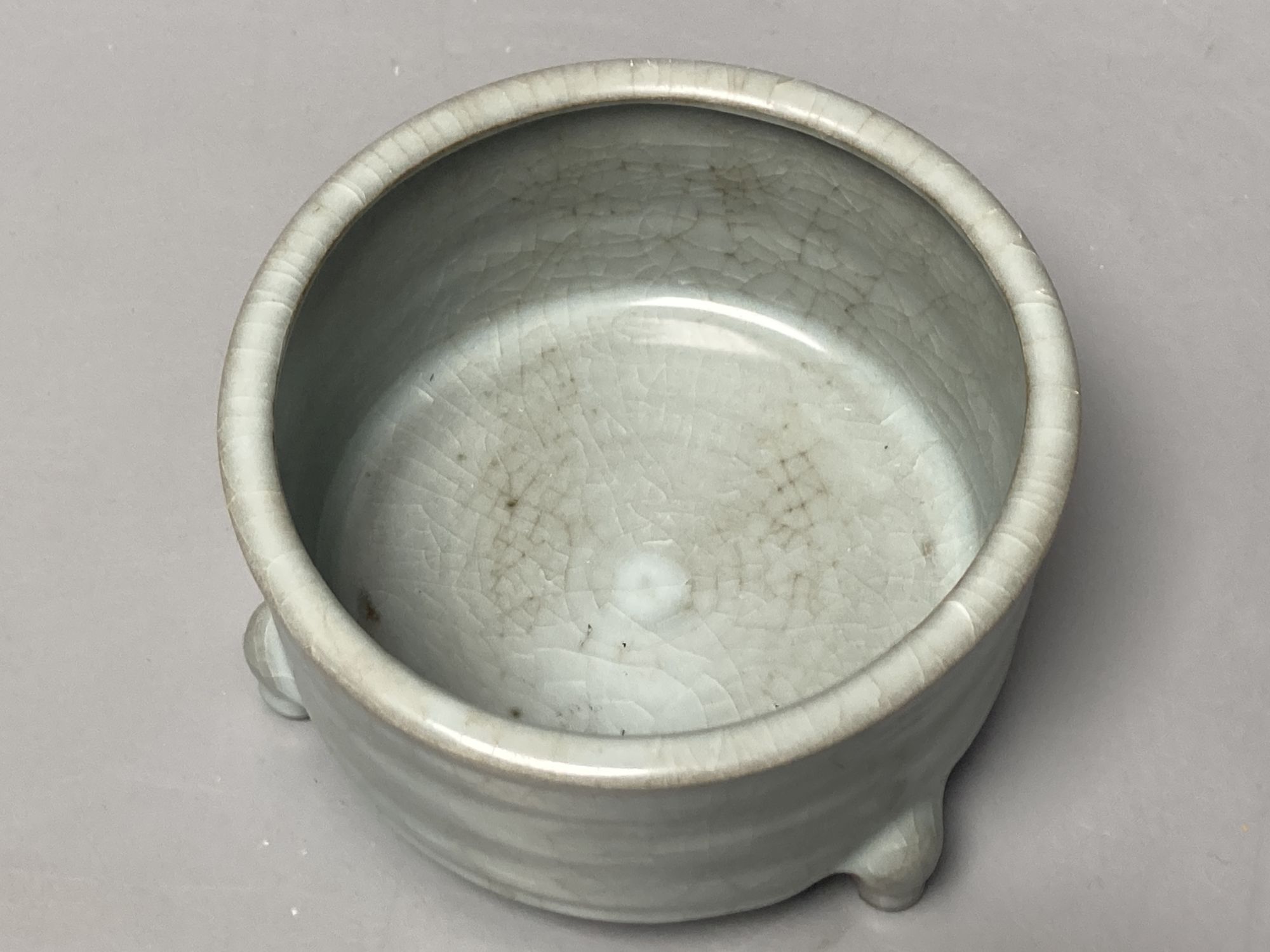 A Chinese celadon cylindrical censer, diameter 13cm